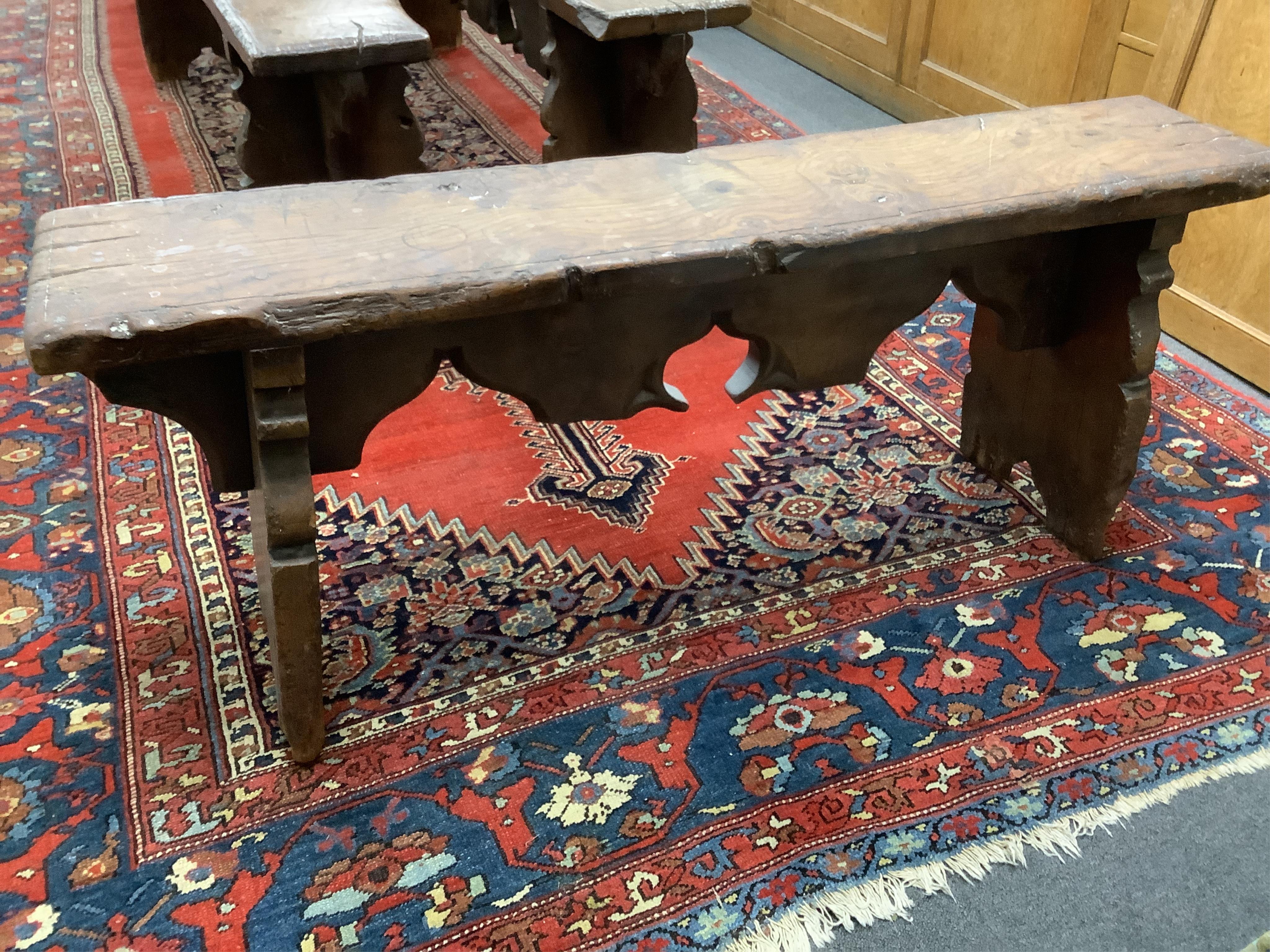 An oak trestle end bench, in Elizabethan style, width 121cm, depth 24cm, height 49cm. Condition - poor to fair, Provenance - made for Brede Place, Brede, Rye, East Sussex. Commissioned from Stuart interiors who have furn